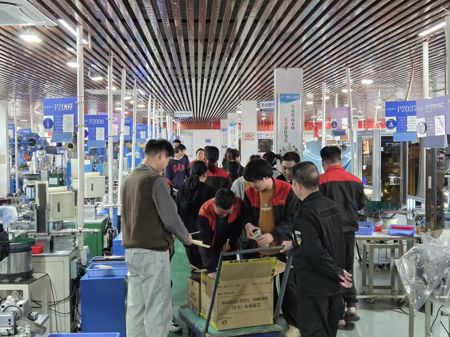 Larry distributing Christmas milk tea to connector factory employees