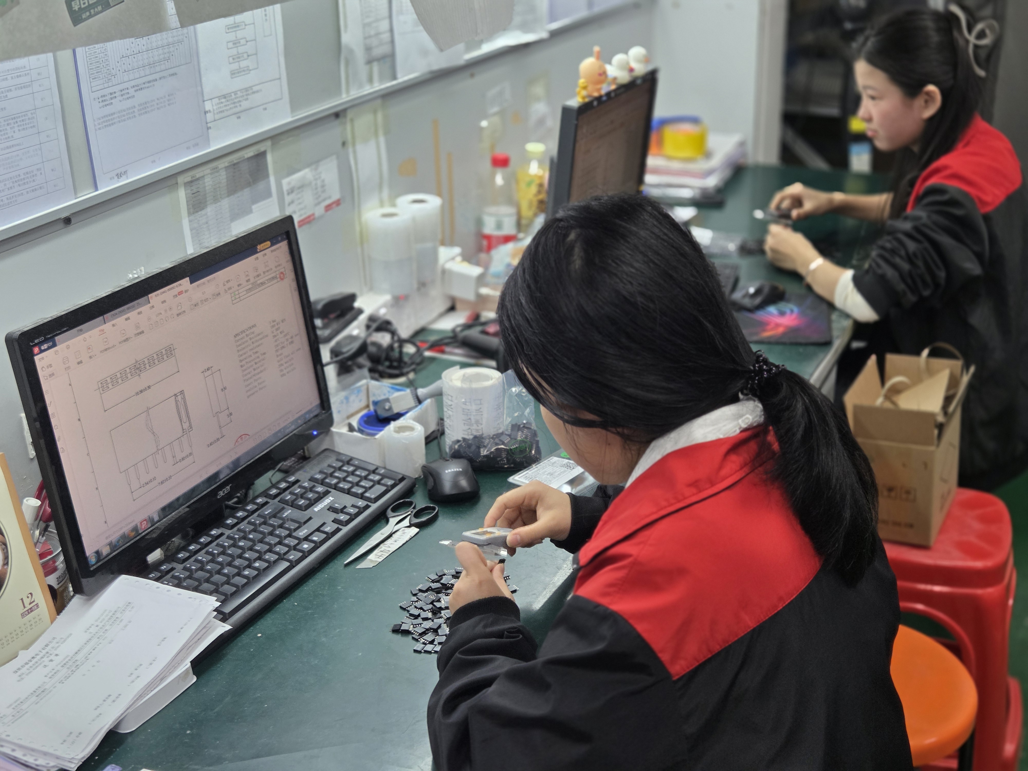 OQC team member verifying product packaging and labels as the final stage of our Quality Control Process
